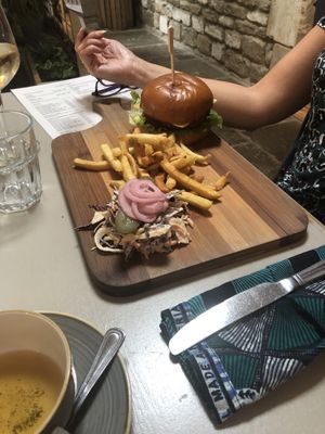 Burger on a massive board at Harp & Crown in Corsham