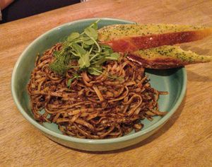 Black olive & almond pesto pasta with garlic bread at Harp & Crown in Corsham