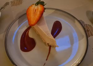 Peanut butter cheesecake with strawberry sauce at Harp & Crown in Corsham