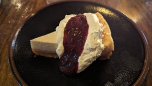 Macadamia cheesecake w/fruit compote $14.00 at The Sunshine Inn in Redfern
