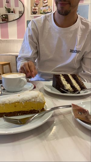 Mango cake, chocolate pistachio cake, oat milk cappuccino! All vegan ! at 2Hearts Bakery in Palermo