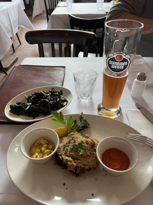 Aubergine with spinach and a glass of wheat beer  at Brenner in Munich