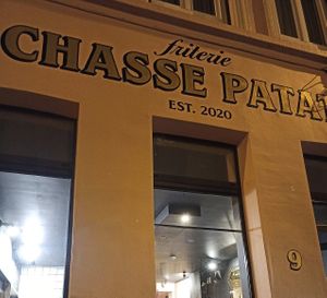 Restaurant facade at Friterie Chasse Patat in Ghent