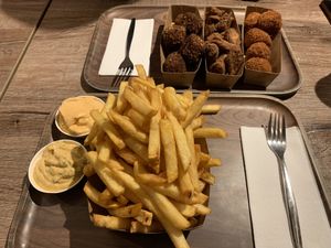 Fries with vegan samurai sauce, vegan drumsticks, vegan fried chicken, vegan bitterballen    at Friterie Chasse Patat in Ghent