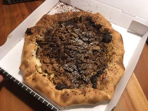 vegan cookie pudding pizza with chocolate filled crust
 at Pizzeria Märchenwald in Essen