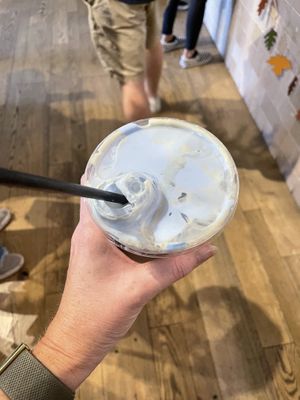 Cold brew with coconut cream and blue spiralina   at Eat Real Cafe in Valencia