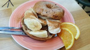 Banana, syrup and cinnamon on a cinnamon-raisin bagel at Bagels & Beans in Leiden