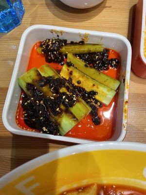 Partially eaten cucumber chili salad. It had a black bean paste.  at Noodle Master in Helsinki