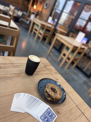 Lovely Truffle Tempeh Bagel. With oat milk latte. Kind staff    at The Well Bean Co in East London