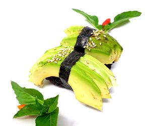 Avocado Nigiri - Fresh sliced avocado with sesame seeds on black rice. at Daikon Vegan Sushi in Las Vegas