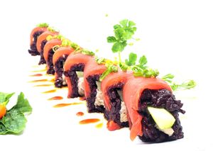 Lucky Red Roll - Jackfruit salad and cucumber inside. Topped with roasted tomato, la-yu, sweet soy, and green onions. at Daikon Vegan Sushi in Las Vegas