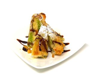 Fried Banana - Tempura fried banana and sticky rice wrapped in lumpia skin. Served with chocolate syrup and powdered sugar. at Daikon Vegan Sushi in Las Vegas