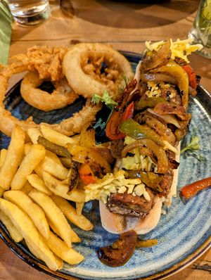 Black bean and chickpea hotdog with onion rings and fries at The Dirty Bottles in Alnwick