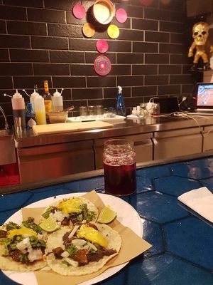 Tacos al pastor and agua de Jamaica (hibiscus)! at Poncho Tacos in Athens