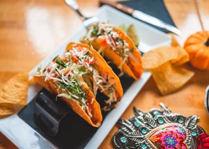Vegan Tinga Crunchy Tacos ( taco trio made with corn tortilla, filled with Jackfruit chipotle Tinga, fresh lettuce, vegan cheese, vegan crema & pico de Gallo.) at Casa Azul Taqueria in Providence