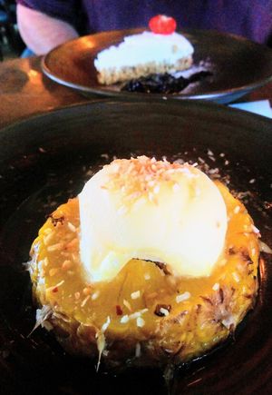 Poached pineapple with coconut, chilli, ginger and sorbet, and vanilla pod cheesecake at Harbour Lights in Paignton