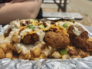 CBR fries—housemade fried chicken, TVP bacon bits, ranch, and scallions over bed of fries  at Cats Luck Vegan in Neptune City