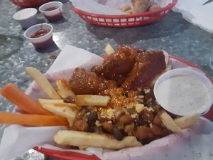 Vegan wings on the vegan chili cheese fries at The Other Side HI Diner in Honolulu