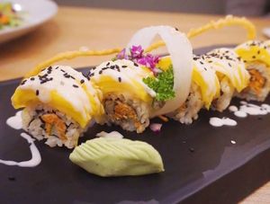 Golden Age sushi. It is top with very sweet mango match with japanese sushi.
Especially the homemade eggless mayonnaise make the perfection for all. Seasonal only. Try your luck ;)  at Sushi Kitchen - Sungai Ara in Penang