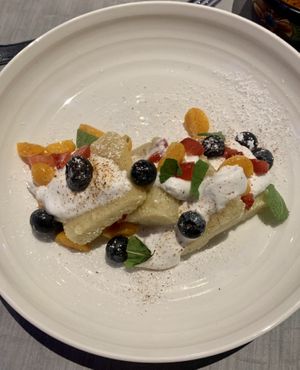 Tres leches cake with seasonal fruit at GuacStar Kitchen and Cantina in Tempe
