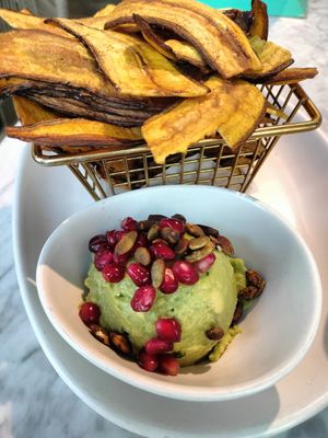 Guacamole w/ pepitas & pomegranate with plantain chips at Tocaya Modern Mexican in West Los Angeles