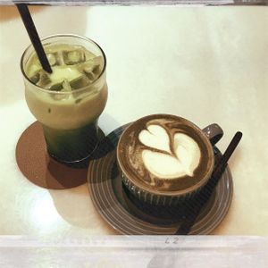 Matcha latte ($6 + ice $0.50 + oats $0.80) -Hojicha latte ($6+ oats $0.80)  at Lucky Cat Cafe in Northeast Singapore