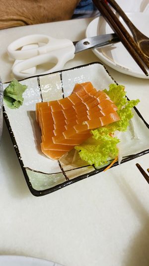 Salmon sashimi  at Lucky Cat Cafe in Northeast Singapore