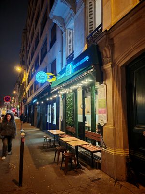 Green farmer facade by night at Green Farmer's in Paris