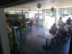 Shaded outdoor seating at Codie's Place in Agnes Water