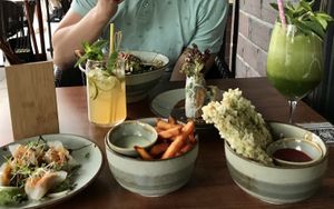 dumplings, fries, crispy tofu and a bowl  at BODHI - Vegan Living in Hamburg