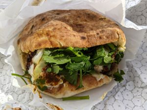 Falafel Sandwich with hummus, cabbage salad, tahini. at TLV in Austin