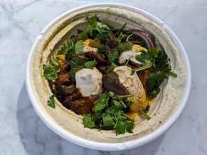 Mushroom Shawarma with hummus, red onions, tahini, and a pita. at TLV in Austin