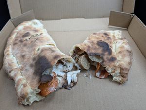 It was slightly undercooked and the cheese wasn't melted. Some parts were still cold. The red sauce was ice cold. at Al Forno Ferruzza Pizza in Rhododendron