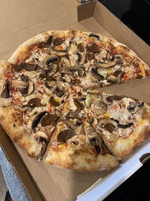 Build your own - seitan sausage, roasted garlic, bell peppers, shallots, mushrooms. So good   at Big Nonna's in Austin