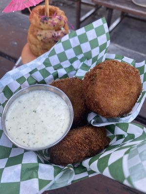 Thick-cut glittery fried pickles with jalapeño ranch at HapPea Vegans in Austin