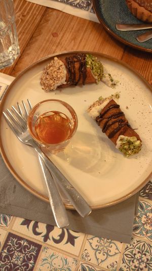 Cannolo and rum at Status Quo in Rome