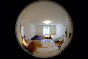 Room with two beds. There is a desk in each room and free internet via cable. at Skärva Gård in Karlskrona