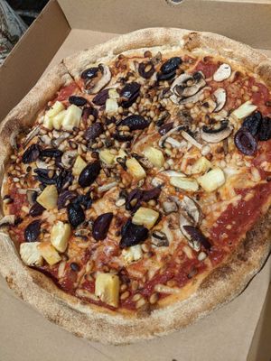 Build your own vegan pizza with pineapple, olives, mushrooms and pine nuts at Pure Pizza in Edinburgh