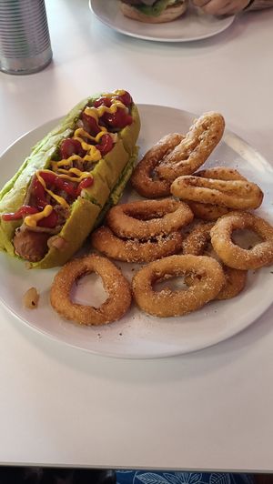 Classic hotdog And onion rings at Plant N Vibe – Street Food by Plant N Plate in Birmingham