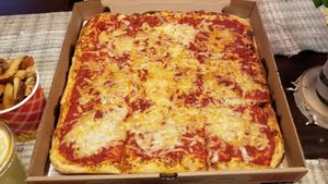 Square with cheese blend topping at Boardwalk Vegan in Havertown