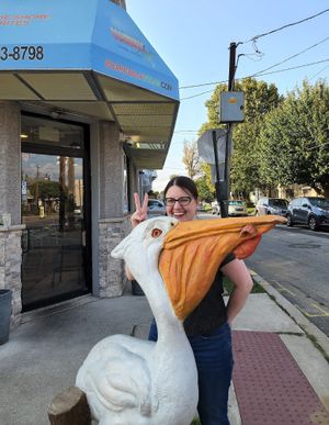 I was admiring the pelican out front, and an employee offered to take my picture with it.  :) at Boardwalk Vegan in Havertown