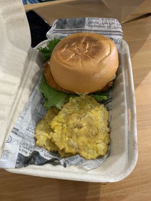 Spicy chicken sandwich with tostones (fried plantain) at 100% HP in San Juan