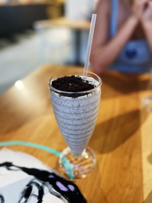 Cookies n creme milkshake. This is 1/2 portion because the nice server split it into two cups for me and my daughter.   at 100% HP in San Juan