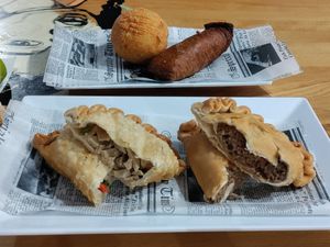 Empanadillas in front, relleno de papa and alcapurria behind at 100% HP in San Juan