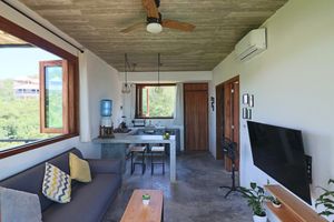 The living room and kitchen at Casa Mauna in San Pedro Pochutla