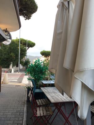 Seating outside  at KLIKKEAT in Carrara