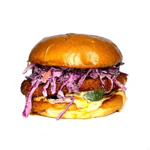 The Grandeza Nashville Hot Chicken* Sandwich. Crispy Chicken* served with our House-Made Pickles, Sauce*, Slaw* and Grandeza Hot Sauce on a Brioche* Bun. 

*Plant-Based at Extra Market in Los Angeles