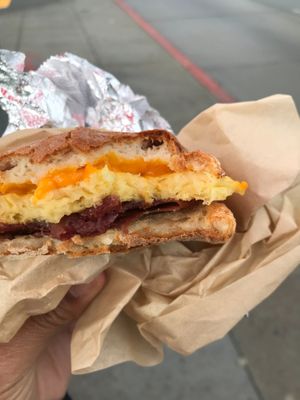 Vegan bacon, egg, and cheddar sandwich at The Happy Vegan in San Francisco