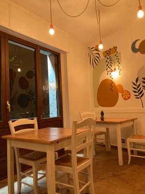 Inside: huge windows and nice wall decors  at Nativa in Rome