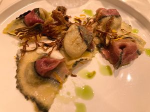 Artichoke tortelli, cashews fondue, orange zest, mint oil  at Nativa in Rome